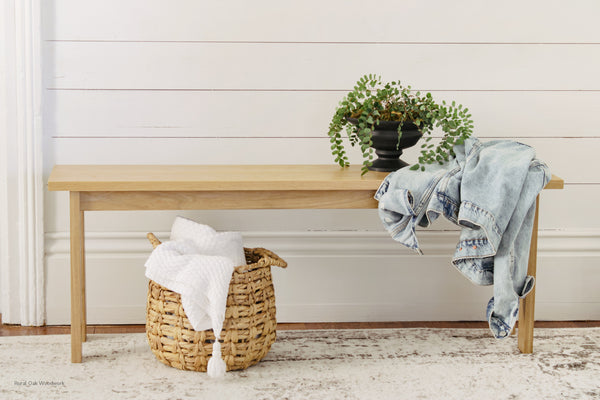 Classic handmade oak bench. Styled with a plant and denim jacket.