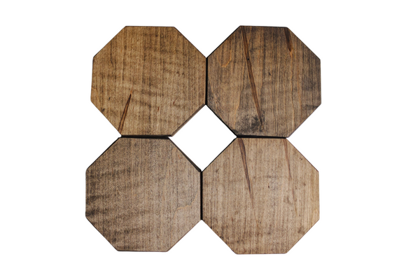 Four wooden octagon coasters in wormy maple.