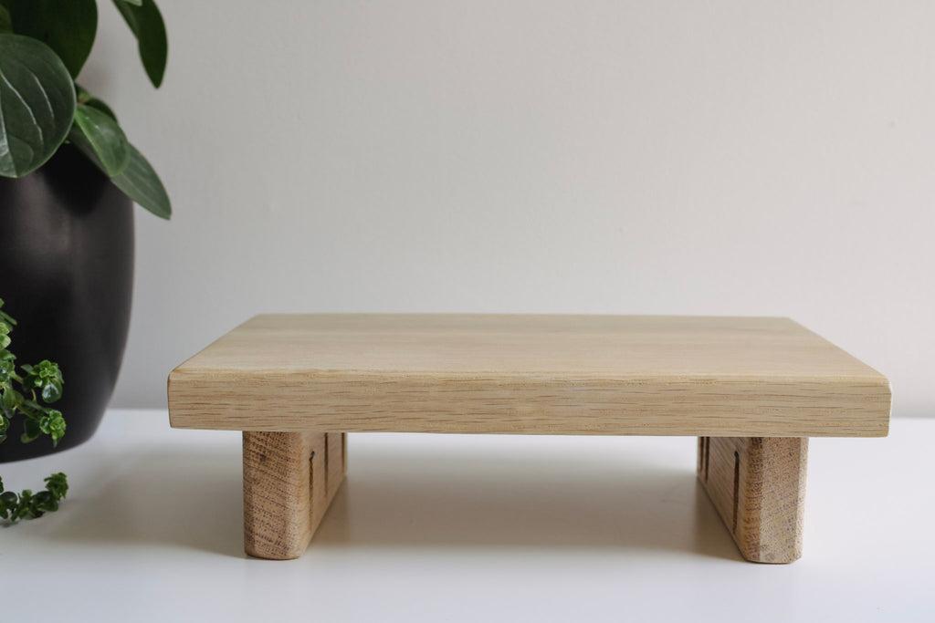 Small oak wooden tray. Image shows the details of the wooden legs on the tray.