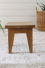 Side image of the oak step stool showing the tapered legs.