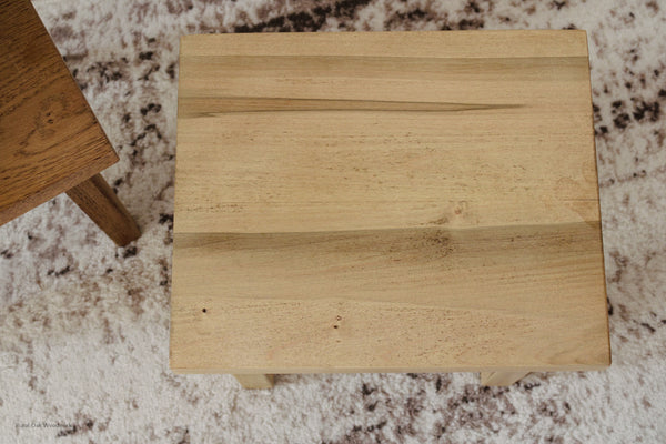 Image off the top of the step stool showing the beautiful character of the wormy maple wood.