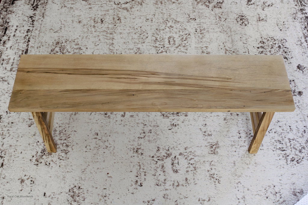 Top view of the bench showing the beautiful wood grain of the wormy maple wood.
